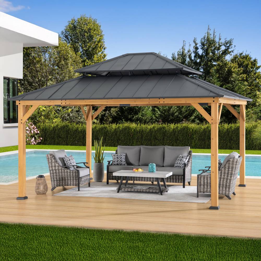Wooden gazebo with a black roof on a patio by a pool