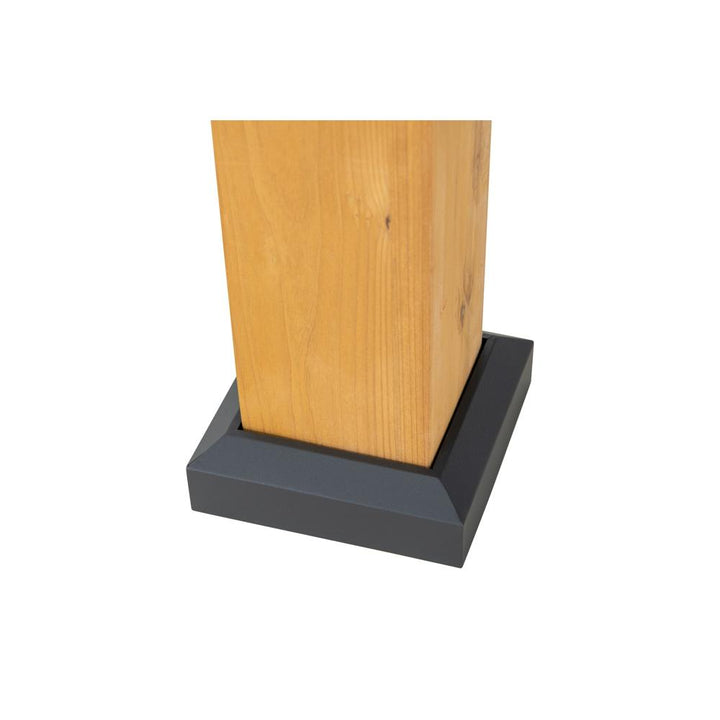 Wooden post with a black base on a white background