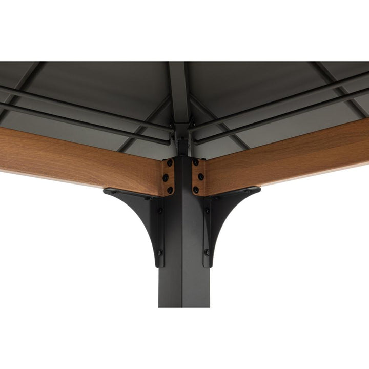 Close-up of a metal bracket connecting wooden beams on a white background
