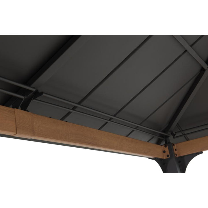 Close-up of a black metal canopy with wooden beams on a white background