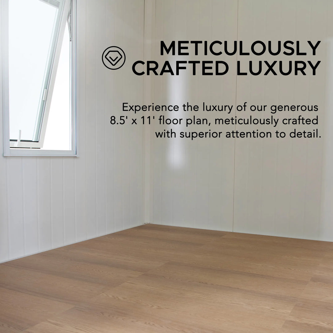 Empty room with wooden flooring and text about meticulously crafted luxury.
