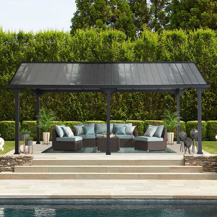 Outdoor patio with pergola, furniture, and pool in a garden setting