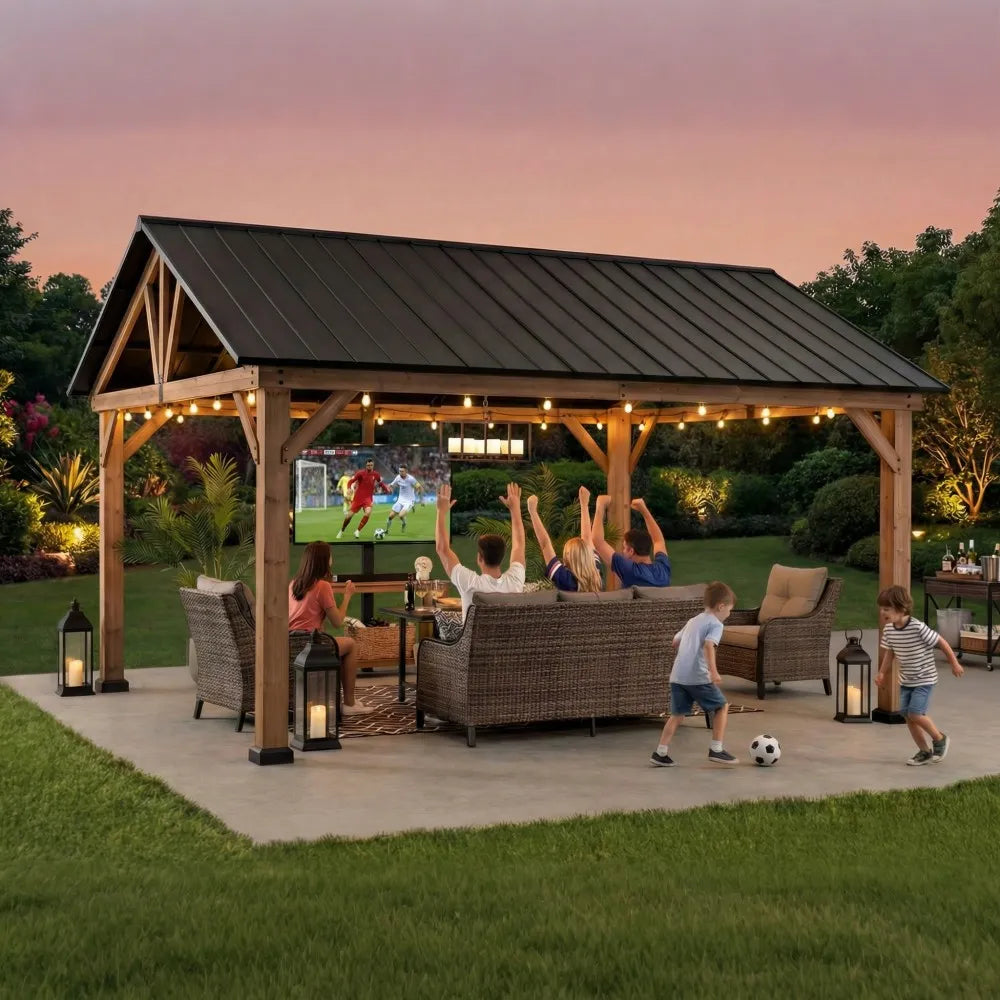 Wooden pavilion with outdoor furniture and people watching a game on a screen.