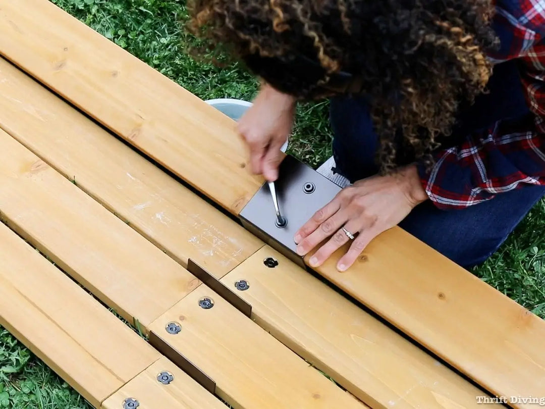 A person is assembling a gazebo