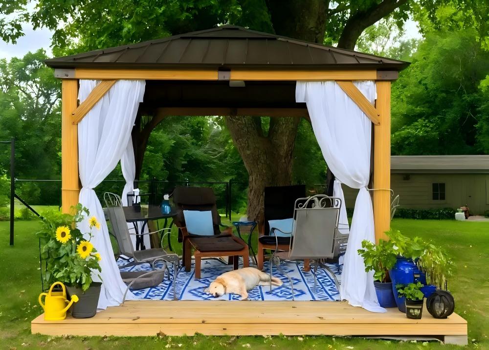 Gazebo with outdoor furniture and decorations in a garden setting