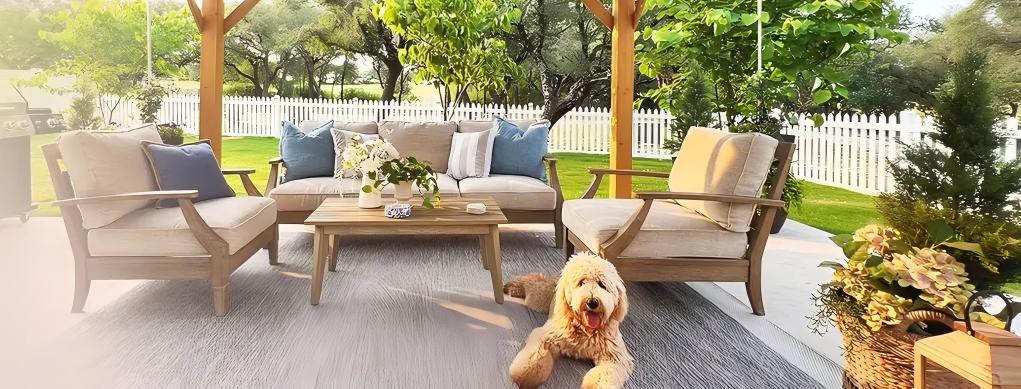 Outdoor patio set with furniture and a dog on a patio