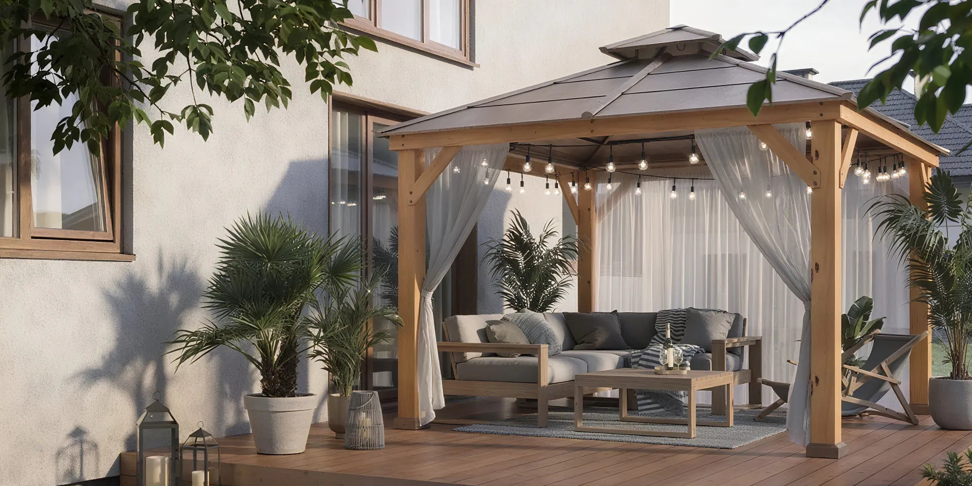 Wooden gazebo with string lights and light netting on the deck